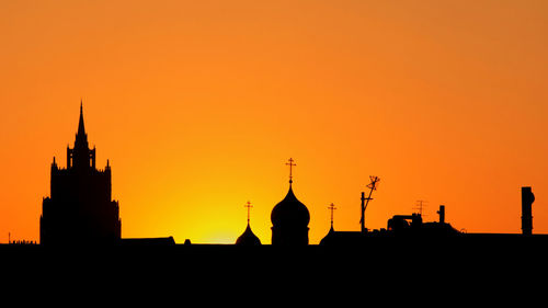 Low angle view of buildings against clear sky