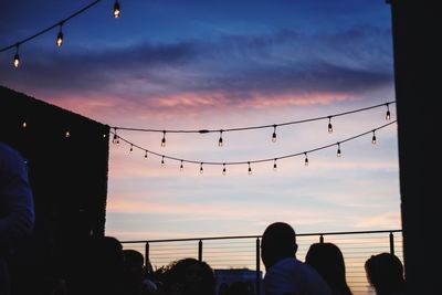 Silhouette of people at sunset