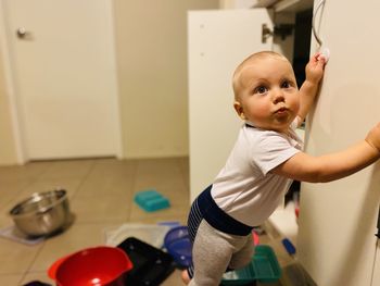 Cute boy standing at home