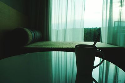 Close-up of coffee cup on table