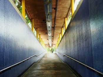 Narrow walkway leading to tunnel