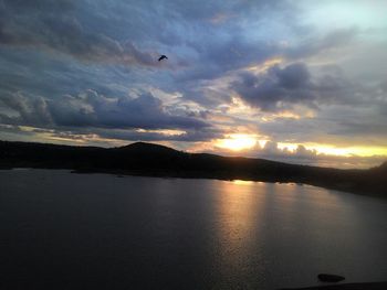 Scenic view of sea against cloudy sky