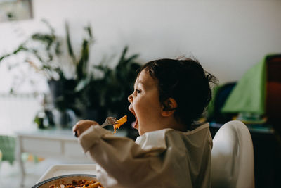 Portrait of child eating food