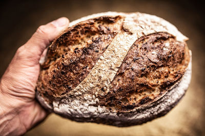 Close-up of hand holding bread
