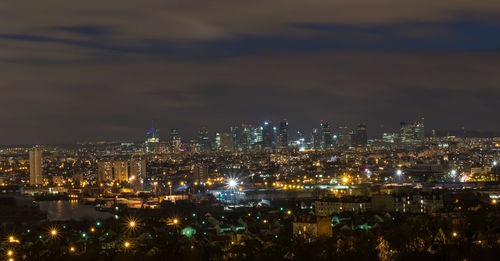 High angle view of illuminated buildings in city at night