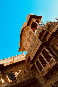 Low angle view of building against blue sky