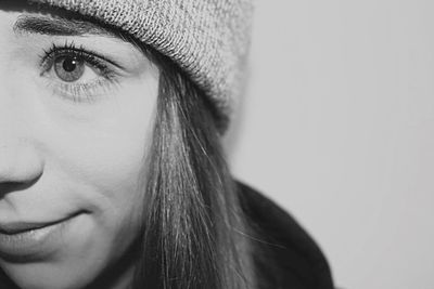 Cropped image of young woman against white background