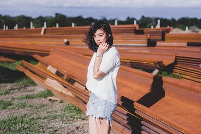 Close-up of woman looking up while sitting on wooden floor