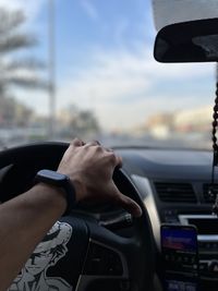 Close-up of man driving car