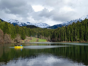 Scenic view of lake with mountains in background