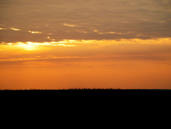 Scenic view of silhouette landscape against sky during sunset