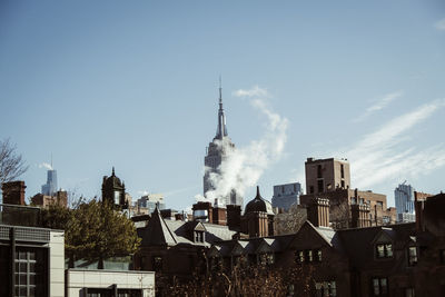 Buildings in city against sky