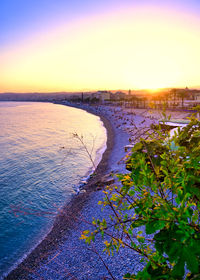 Scenic view of sea against clear sky during sunset