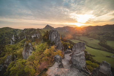 Sunrise at sulov rocks in eastern slovakia. rough, untouched landscape with rocks in orange light.