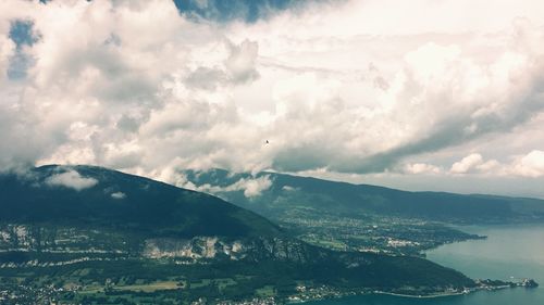 Aerial view of landscape and sea against sky