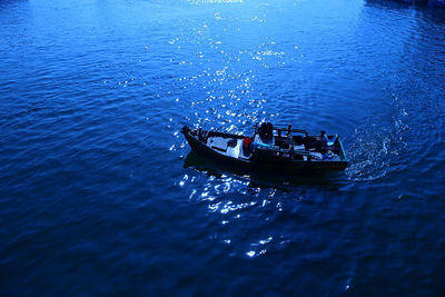 High angle view of boat sailing in sea