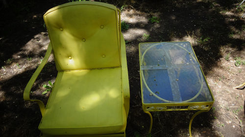 Close-up of yellow slide in park