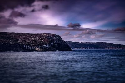 Scenic view of sea against dramatic sky