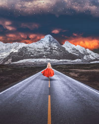 Umbrella on snow covered mountain against sky