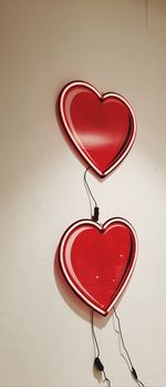Close-up of red heart shape on wall