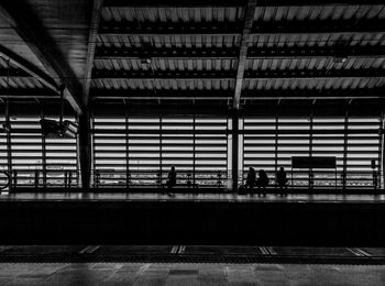 People walking on railroad station platform