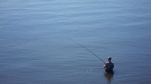 Man fishing in sea