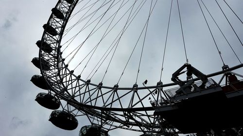 Low angle view of ferris wheel against sky