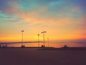 View of calm beach at sunset