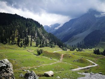 Scenic view of landscape and mountains against sky