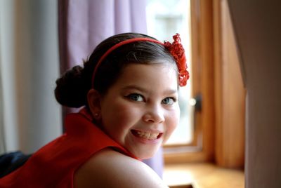 Portrait of cute smiling girl at home