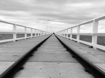 Bridge over sea against sky