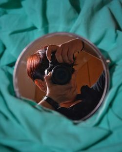 Close-up portrait of boy photographing