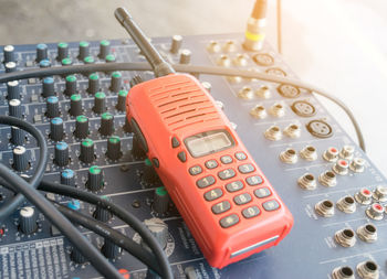 Close-up of walkie talkie and sound mixer