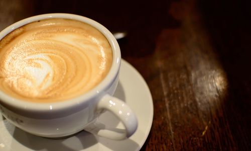 Close-up of cappuccino on table