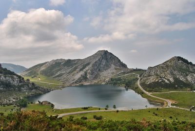 Scenic view of lake and mountains against sky