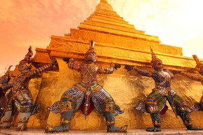 Low angle view of guardian statues at temple