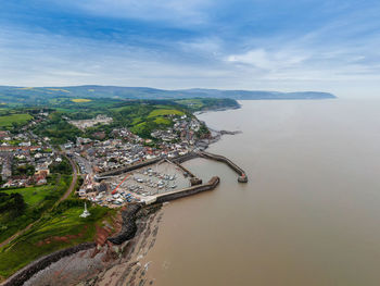 View of sea and harbour with coastline ahead from sky 