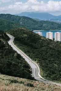 High angle view of road by mountain against sky