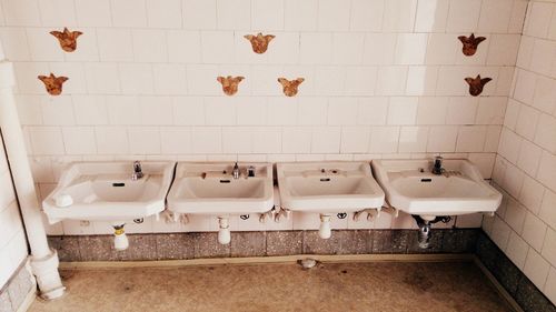 Sinks against wall in public restroom