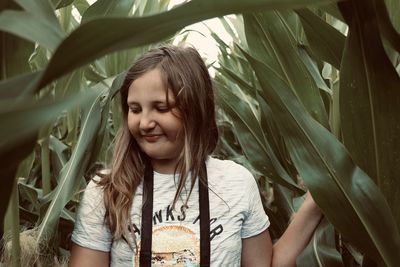 Portrait of a teenage girl in plant