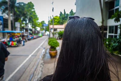 Rear view of man on street in city