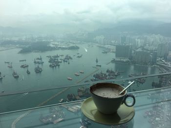 High angle view of coffee and buildings in city