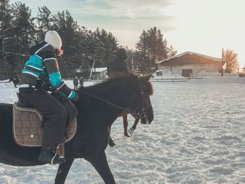 People riding horse in winter