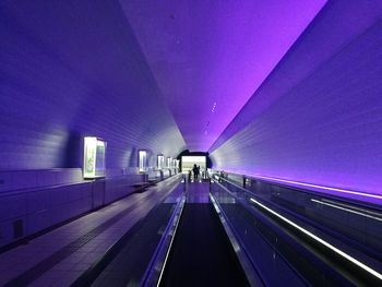 Illuminated lights against sky at night