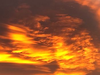 Low angle view of dramatic sky during sunset