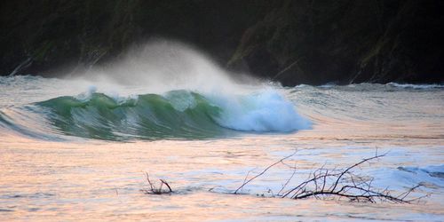 Scenic view of sea waves splashing on shore