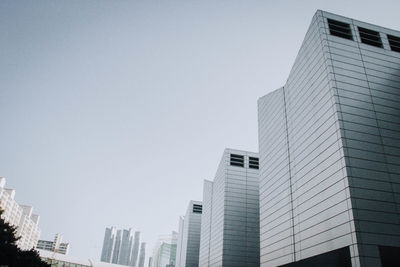 Low angle view of modern buildings against clear sky