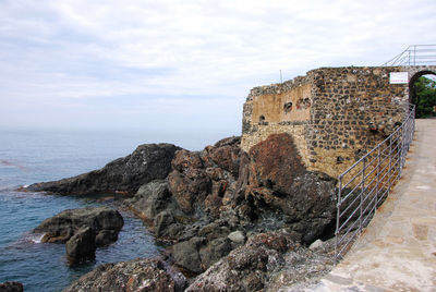 View of fort on sea against sky