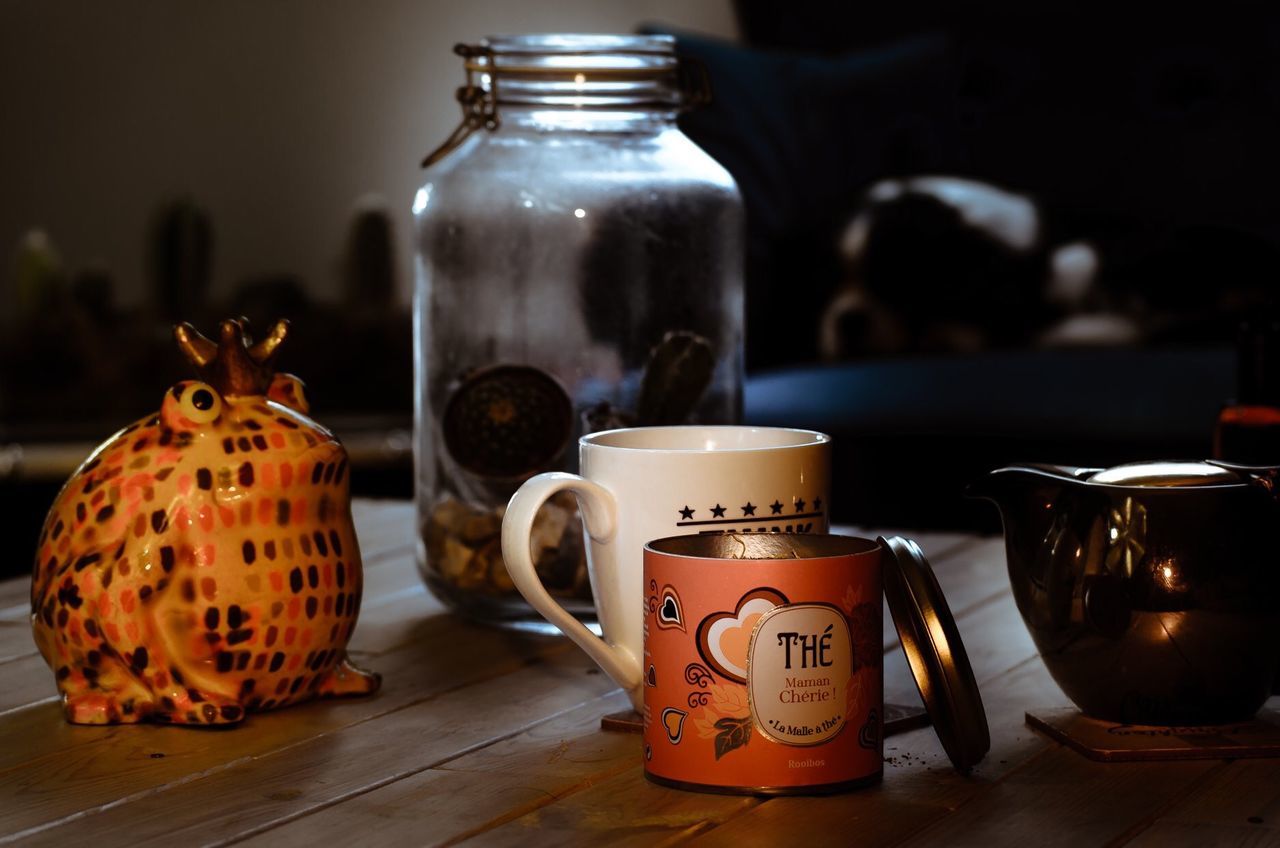 container, still life, art and craft, food and drink, representation, table, indoors, focus on foreground, creativity, no people, close-up, text, jar, food, drink, craft, human representation, teapot
