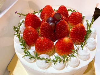 High angle view of strawberries in plate on table